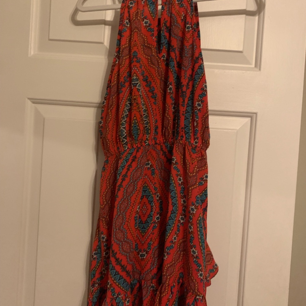 Girls dress with a print. Has ruffles new with tags